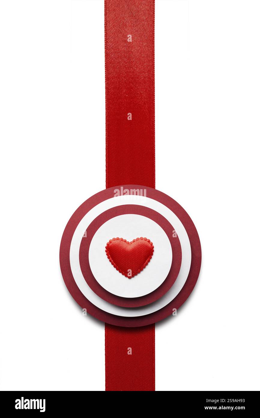 Creative valentines concept photo of a target made of paper and ribbon ...
