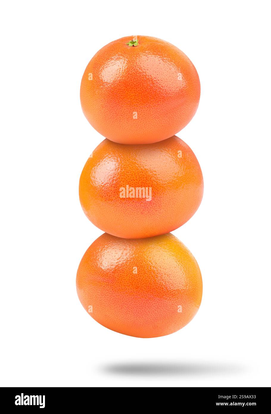 Fresh grapefruits in air on white background Stock Photo