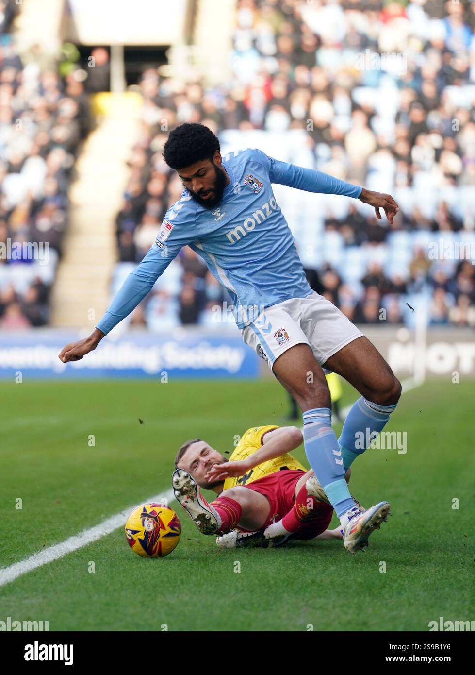 Coventry City's Ellis Simms (right) and Watford's Ryan Porteous battle ...
