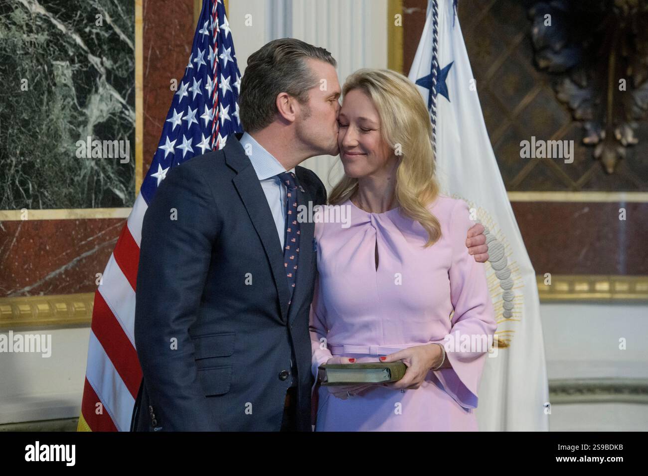 Pete Hegseth, left, kisses his wife Jennifer Rauchet prior to being ...