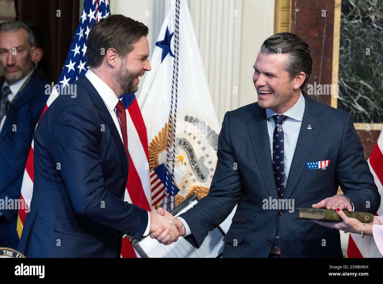 United States Vice President JD Vance, left, shakes hands with US