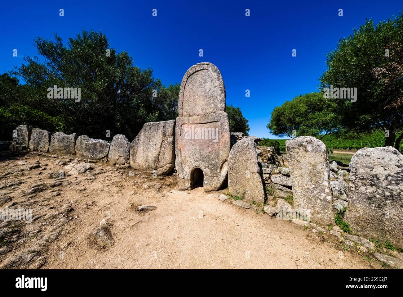 Tomb stones in the Giants' grave of Coddu Vecchiu, Tomba dei giganti di Coddu Vecchiu, a Nuragic funerary monument, dating from the Bronze Age. Stock Photo