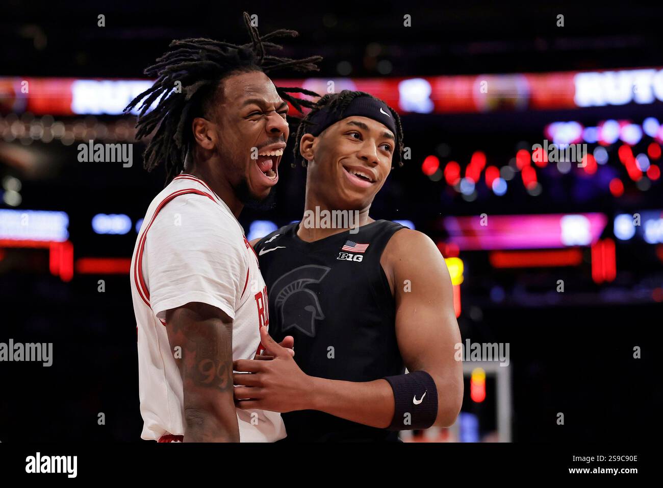 Rutgers guard Jeremiah Williams, left, reacts next to Michigan State ...