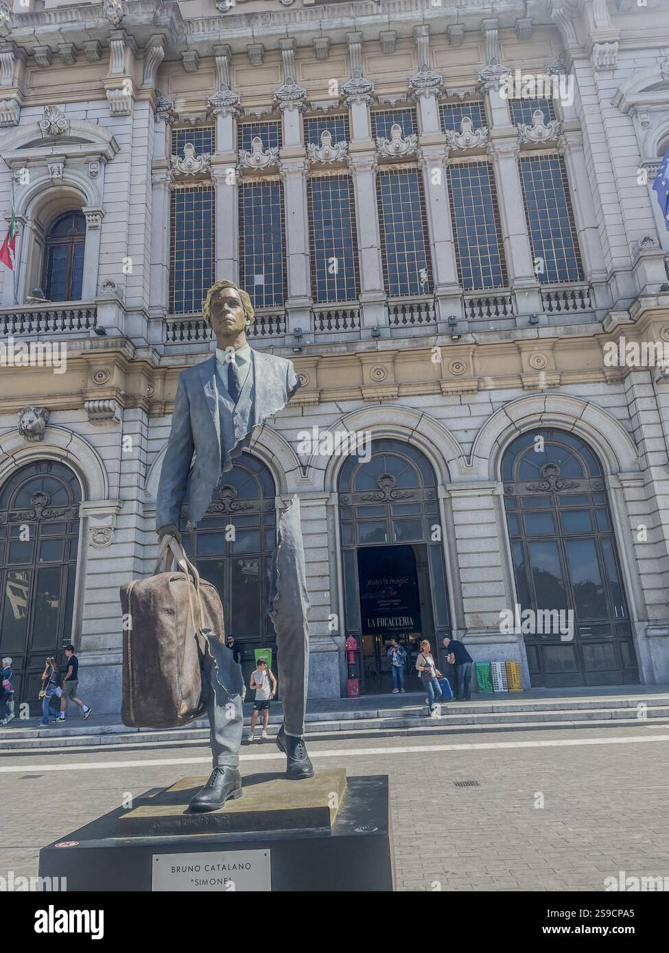 Statues representing ‘the metaphor of travel’: the travellers by Bruno Catalano at Brignole railway station in Genoa - Smartphone Captured Stock Image
