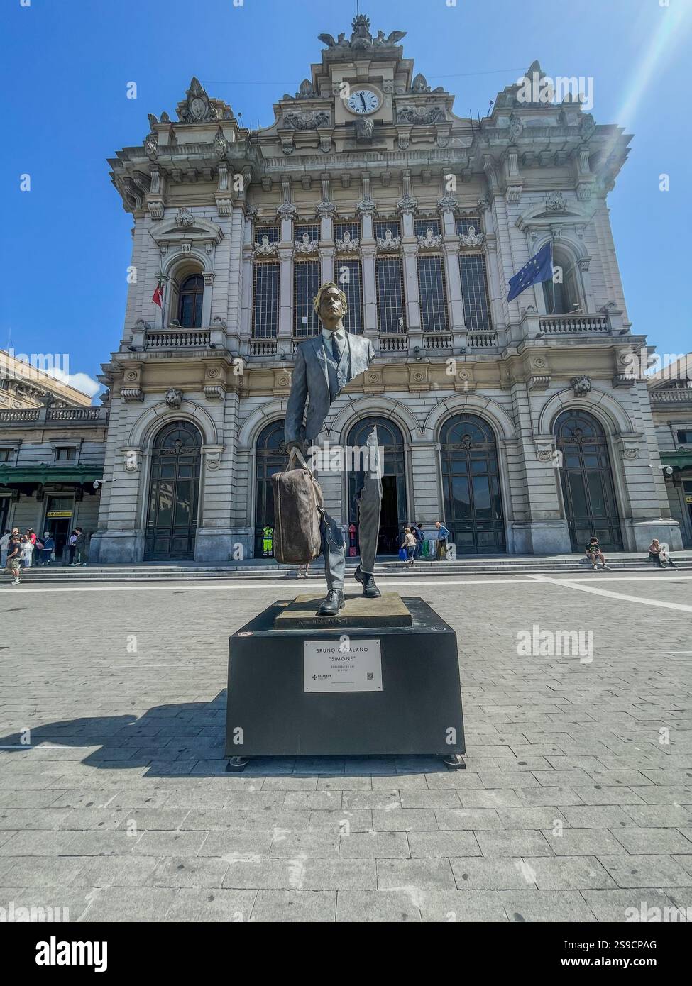 Statues representing ‘the metaphor of travel’: the travellers by Bruno Catalano at Brignole railway station in Genoa - Smartphone Captured Stock Image