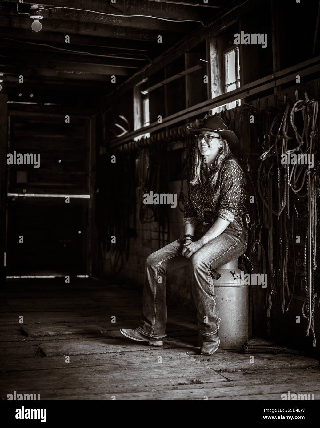 Cowgirl getting ready for the day at a Dude Ranch in Montana Stock ...