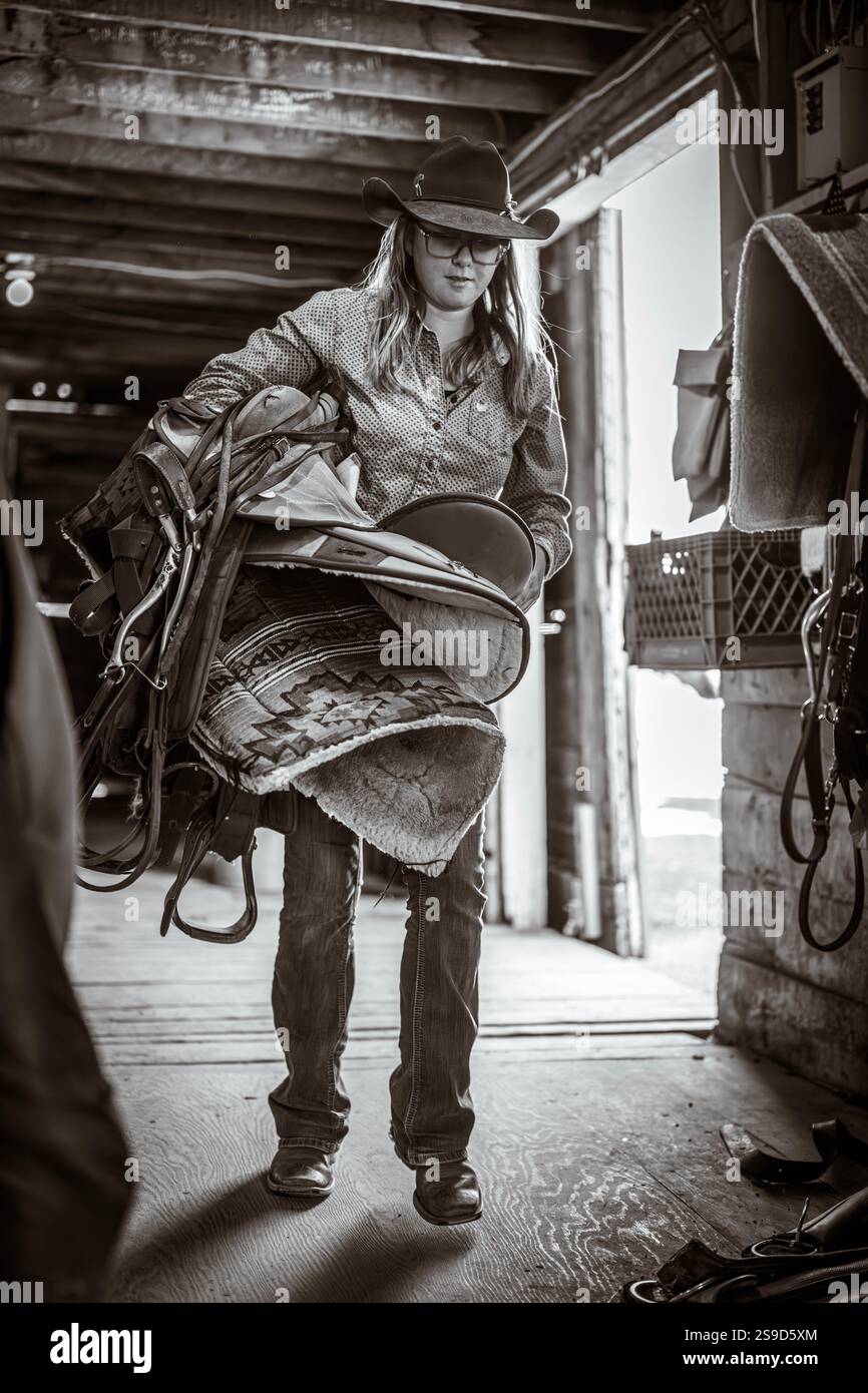 Cowgirl getting ready for the day at a Dude Ranch in Montana Stock ...