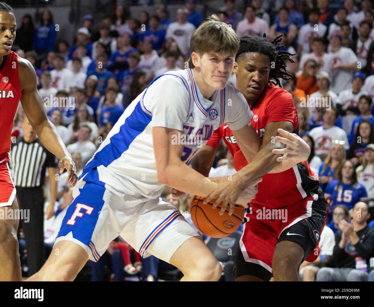 Florida forward Alex Condon left, rebounds against Georgia guard Silas ...