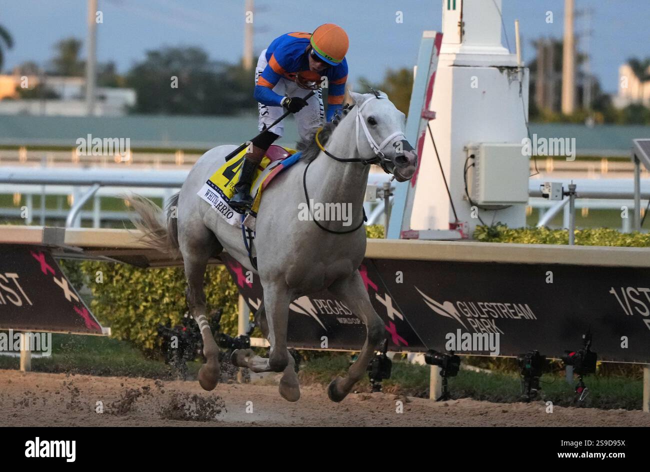White Albarrio, ridden by Irad Ortiz Jr., crosses the finish line to