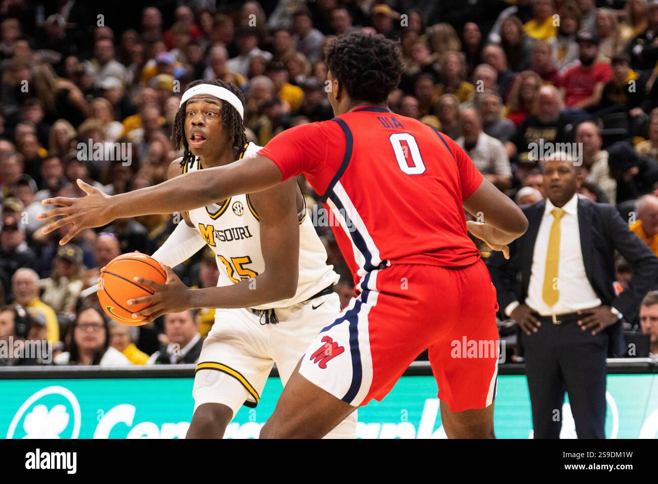 Missouri's Mark Mitchell, left, looks to pass the ball in