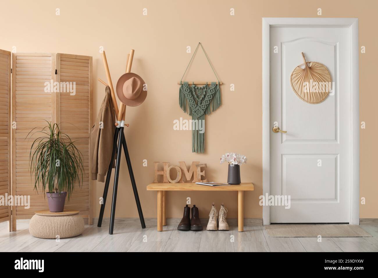 Interior of hall with rack of clothes, bench and white door Stock Photo ...