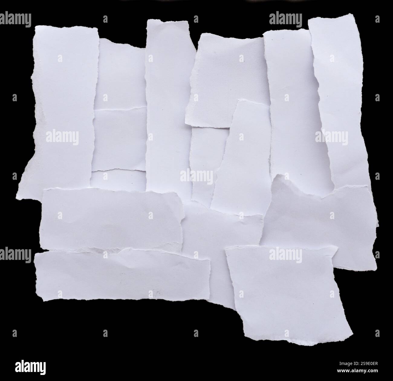 Torn papers on black background Stock Photo