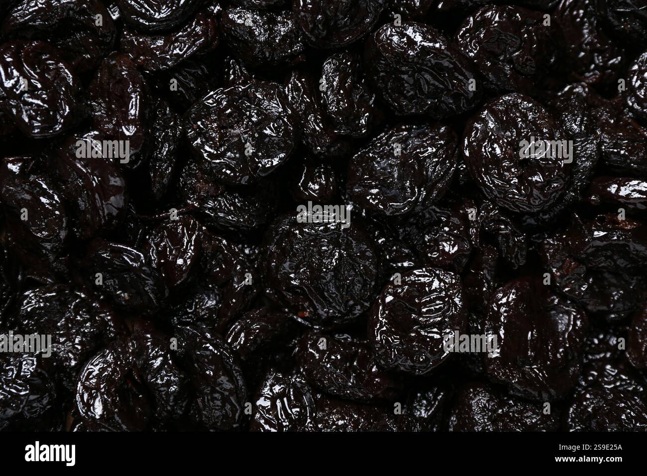 Texture of dried prunes as background Stock Photo
