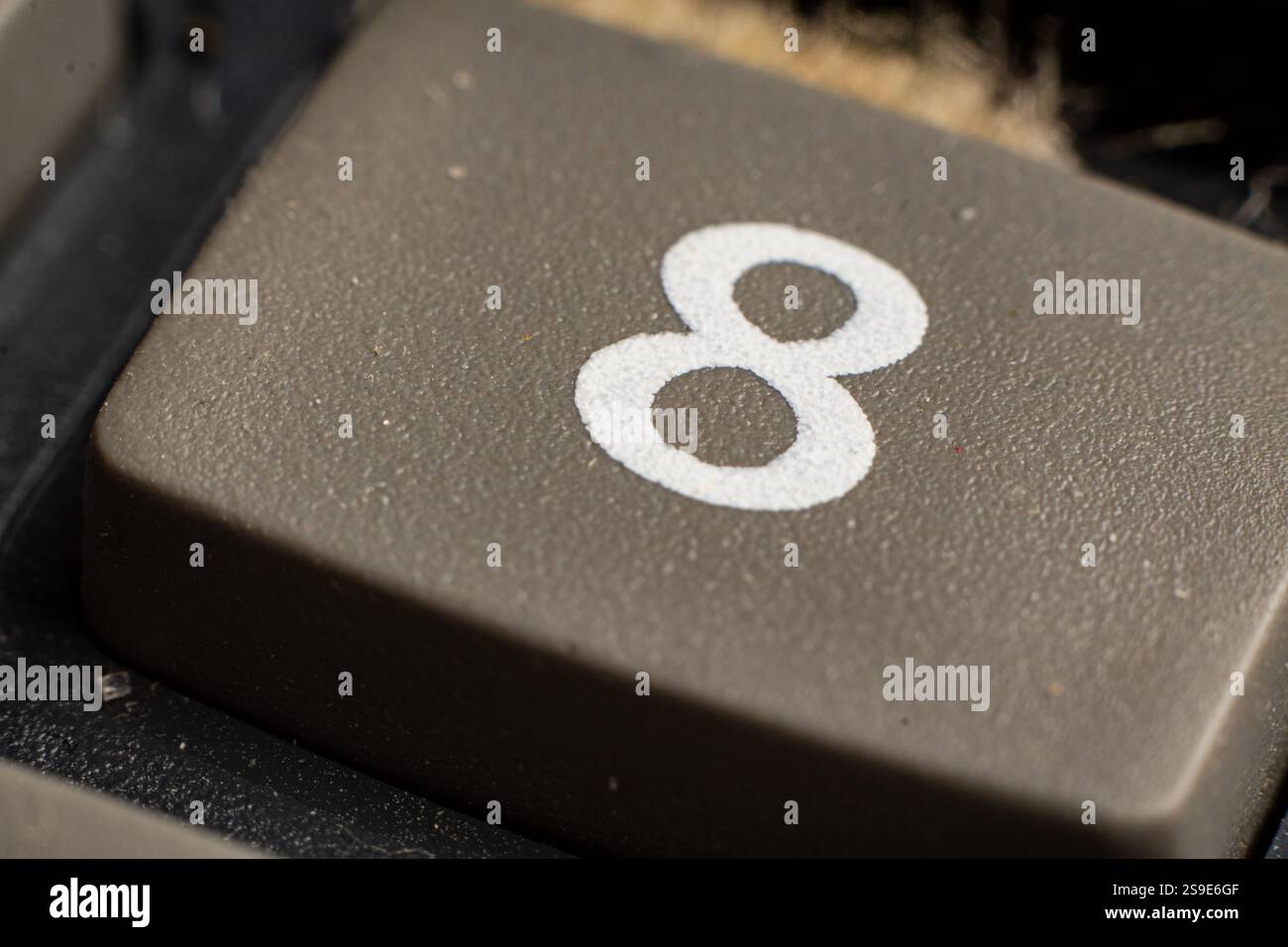 Closeup view of electronic keypad highlighting the number eight button ...