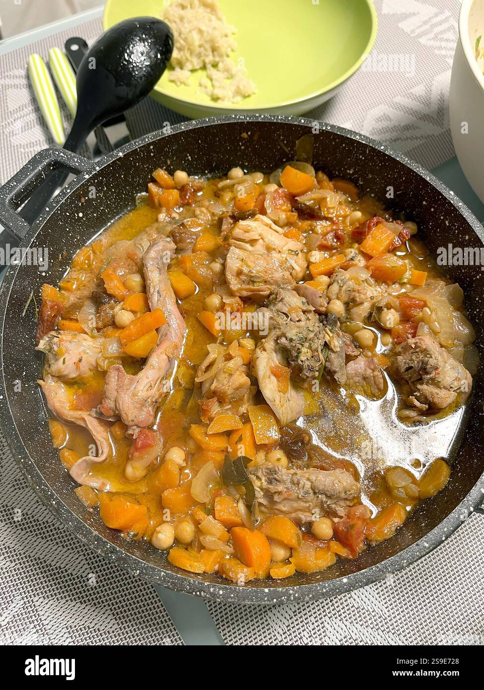Stewed rabbit with vegetables in a skillet. Food and healthy eating ...