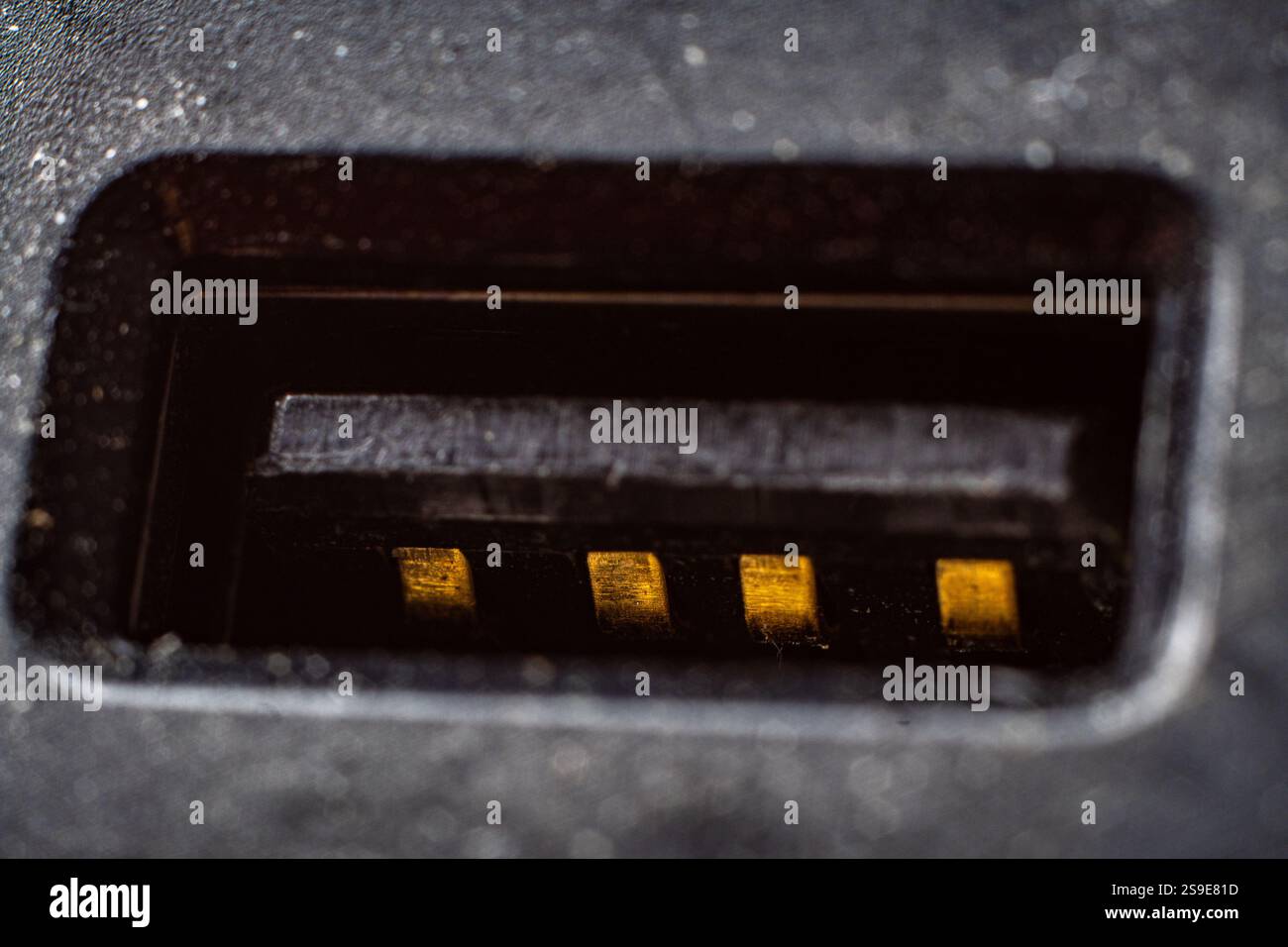 Closeup view of a USB port showcasing its intricate details and metallic contacts Stock Photo