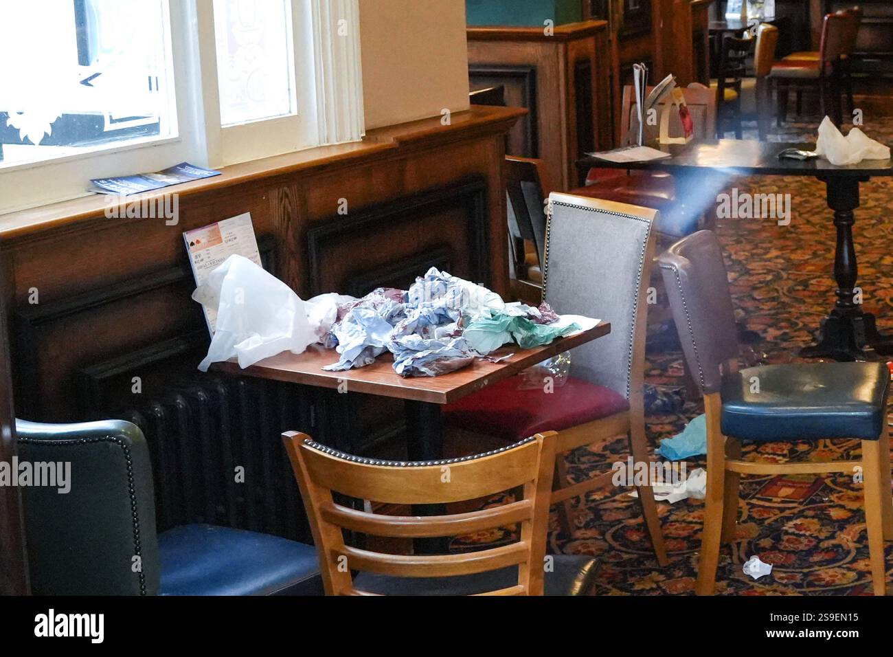 Wharf Road, Kings Norton, Birmingham 26th January 2025 - Police have sealed off a pub in the Kings Norton area of Birmingham after 3 people were stabbed. Officers have since arrested 3 men, 19-year-old man has been arrested on suspicion of attempted murder. First aid and a scene of chaos could be seen scattered on the floor of the pub as attempts were made to treat the wounded. A spokesperson for West Midlands Police said: 'We've arrested three men after three people were injured in a stabbing at a pub in Birmingham. Credit: British News and Media/Alamy Live News Stock Photo