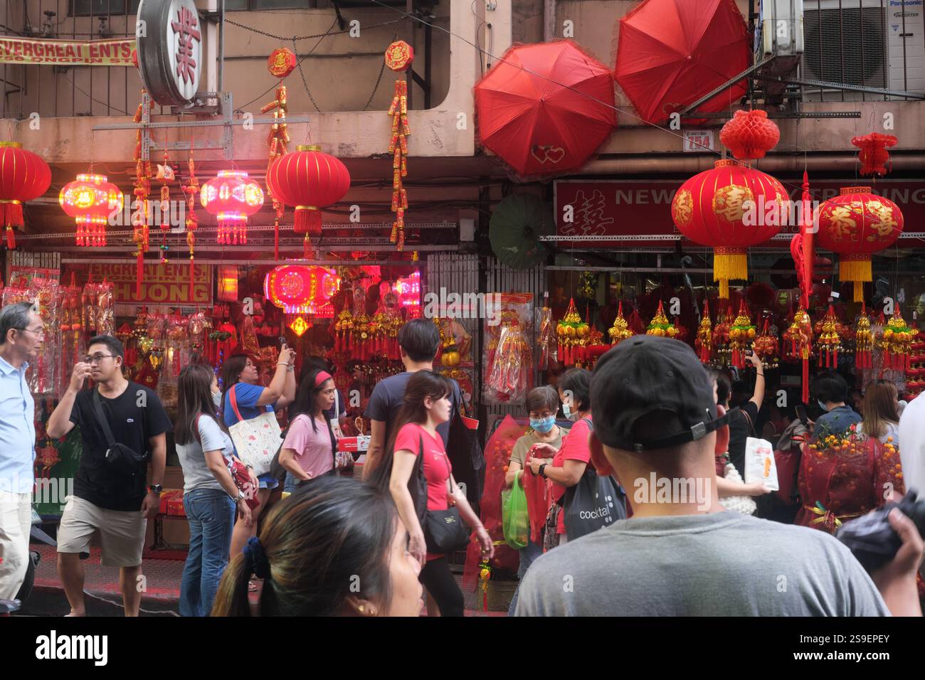 Manila, Philippines - January 25, 2025 : People flock a lantern shop on Ongpin street in the famous Binondo Chinatown before Chinese New Year. Stock Photo
