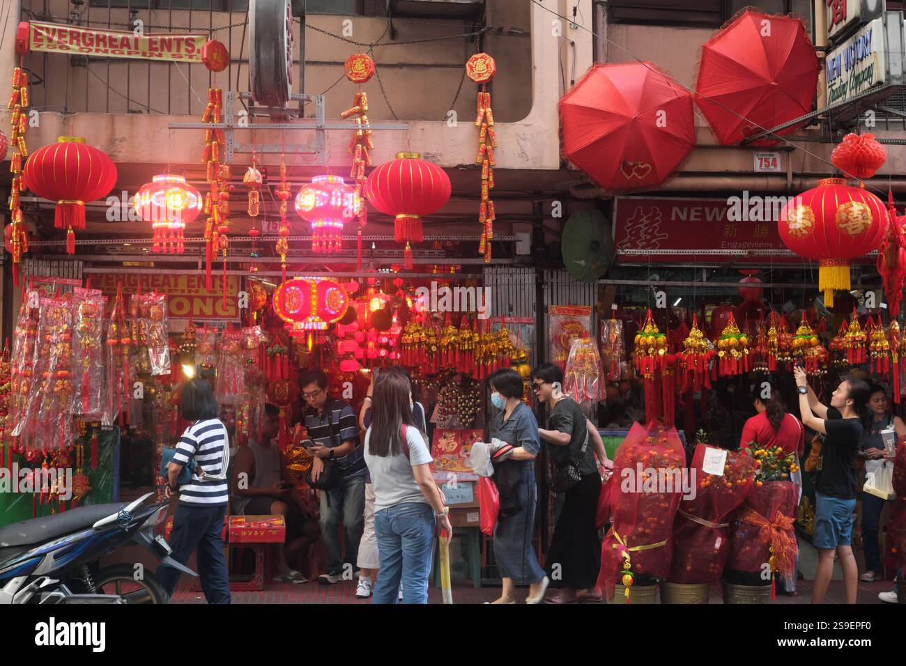 Manila, Philippines - January 25, 2025 : People flock a lantern shop on Ongpin street in the famous Binondo Chinatown before Chinese New Year. Stock Photo