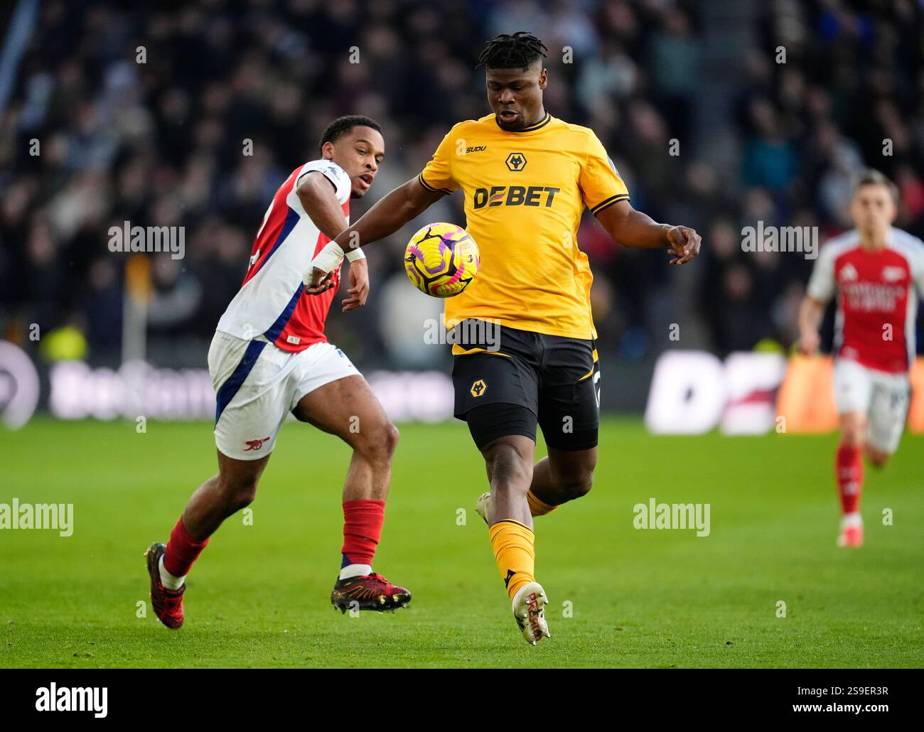 Arsenal's Jurrien Timber (left) and Wolverhampton Wanderers' Emmanuel ...