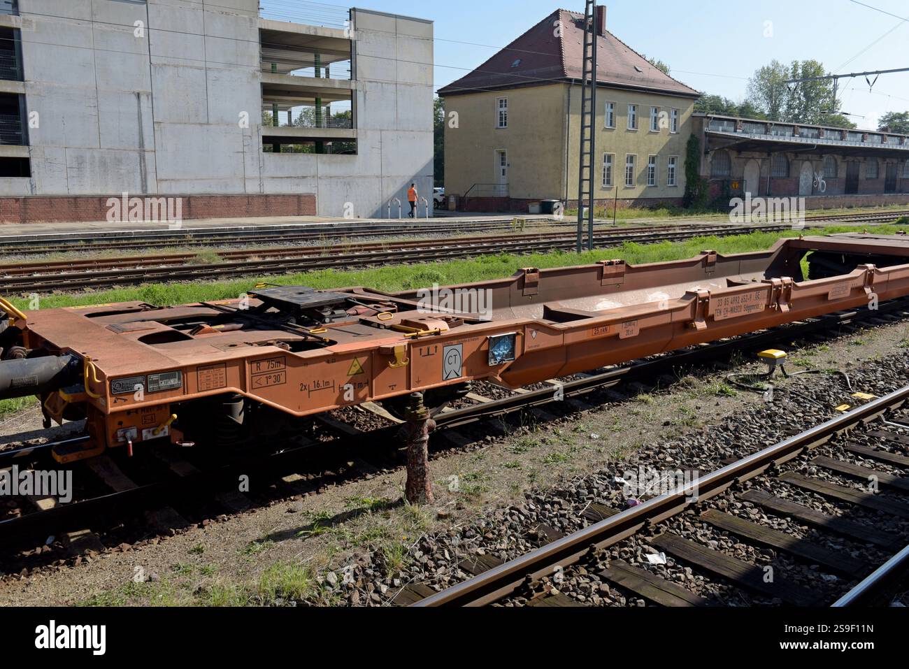 Low floor specialist railway wagon for carrying artic lorry trailer at Frankfurt (Oder), Germany, Sept 2024 Stock Photo