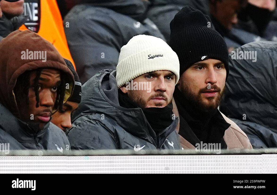 Tottenham Hotspur's James Maddison (centre) watches the action from the ...