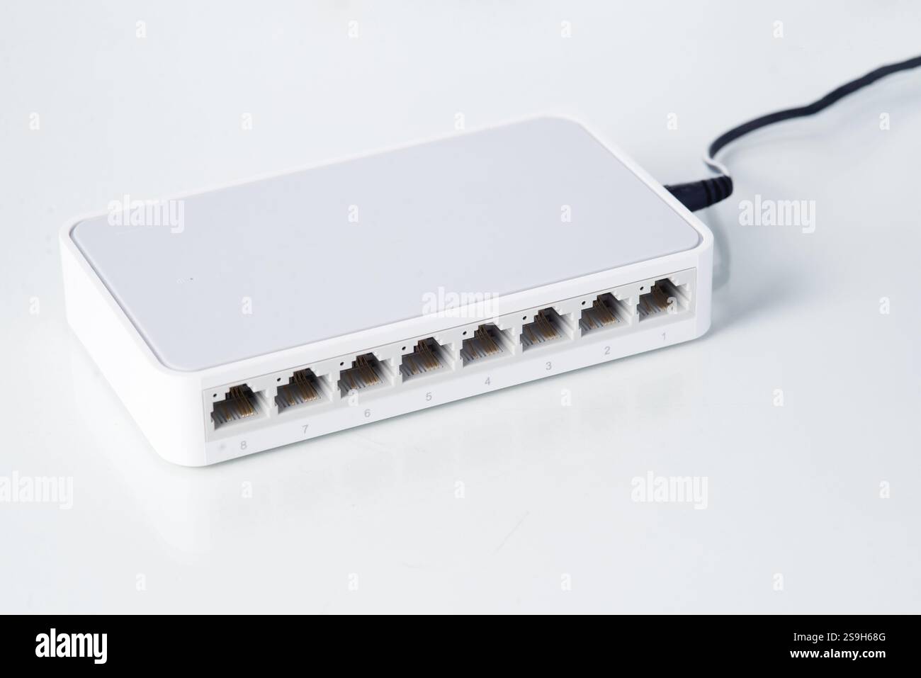 Ethernet network switch with eight ports on a clean background, used ...