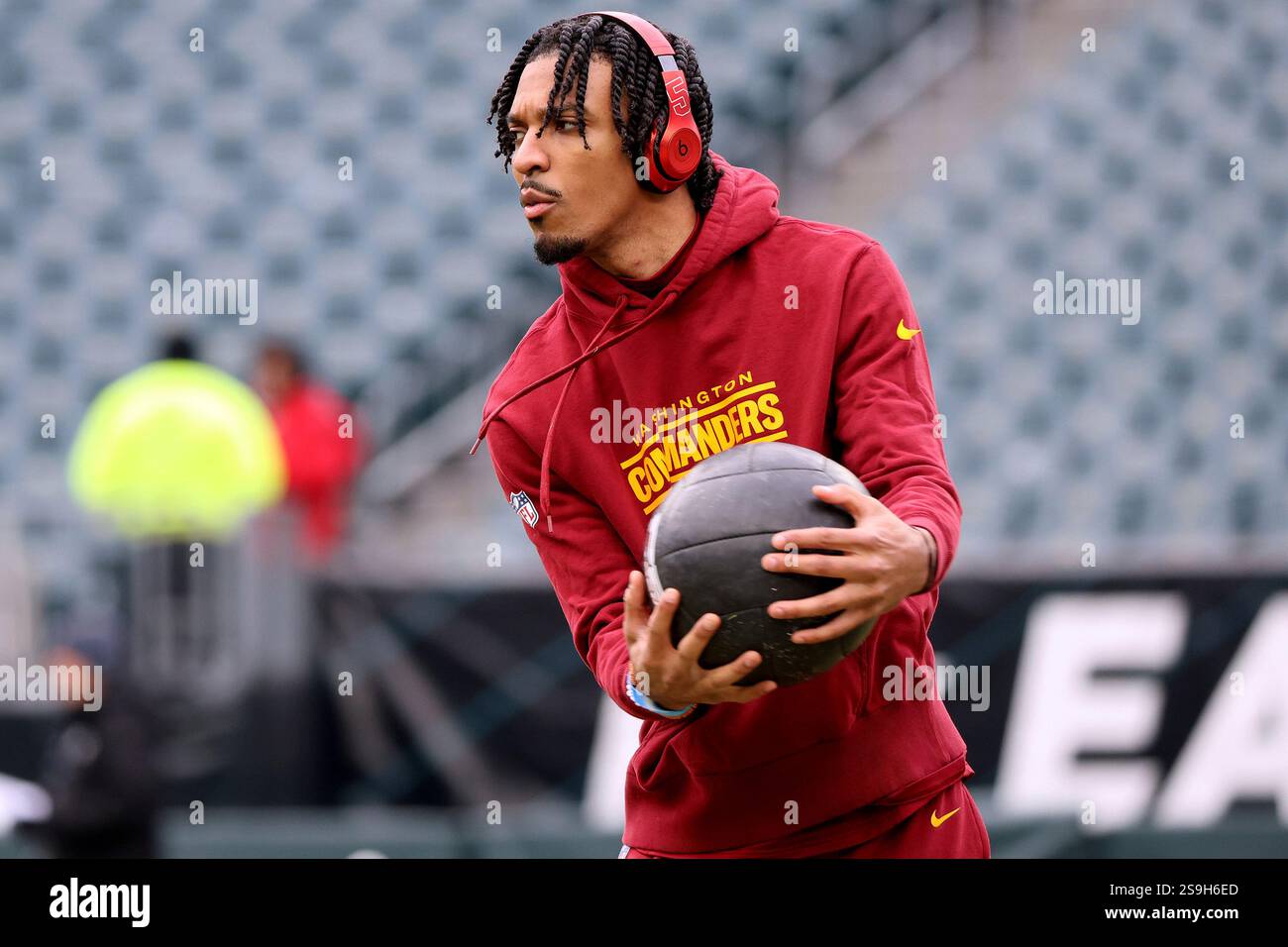 Washington Commanders quarterback Jayden Daniels (5) warms up before