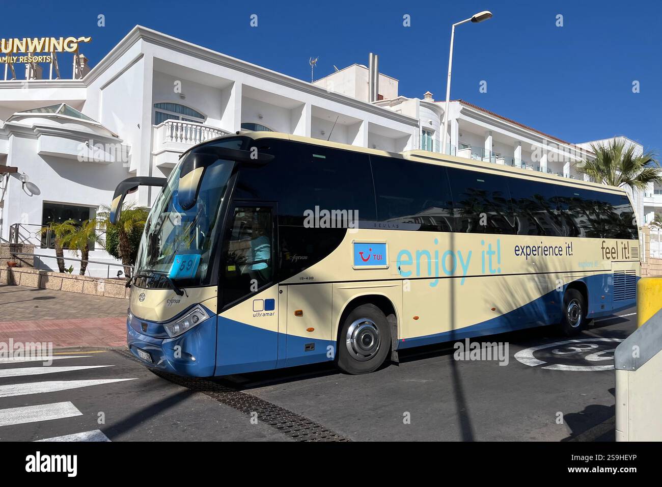 TUI Transfer Bus driving through Costa Adeje. Tenerife, Canary Islands, Spain. 14th January 2025. - Smartphone Captured Stock Image