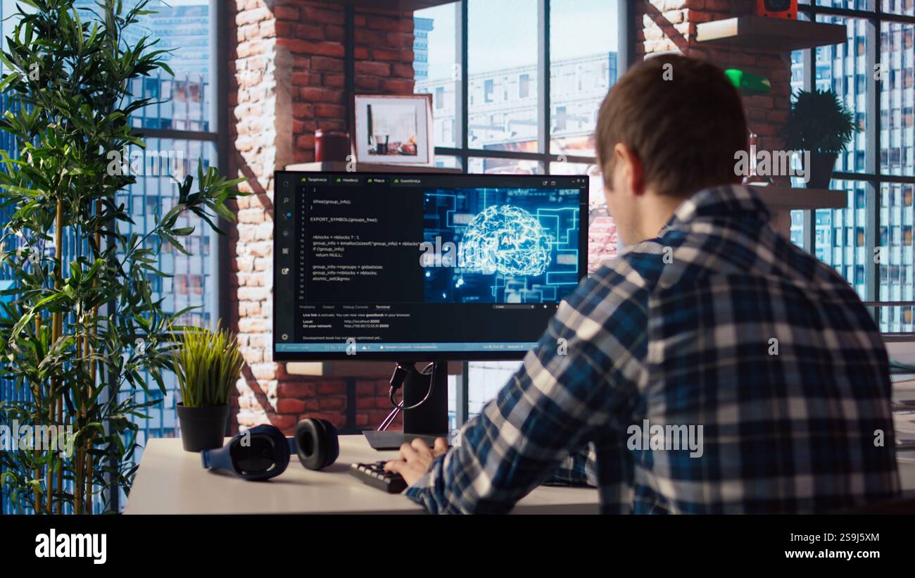 Developer writing code on computer and doing maintenance on artificial ...