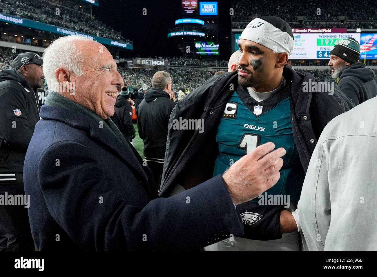 Philadelphia Eagles owner Jeffrey Lurie talks with quarterback Jalen ...