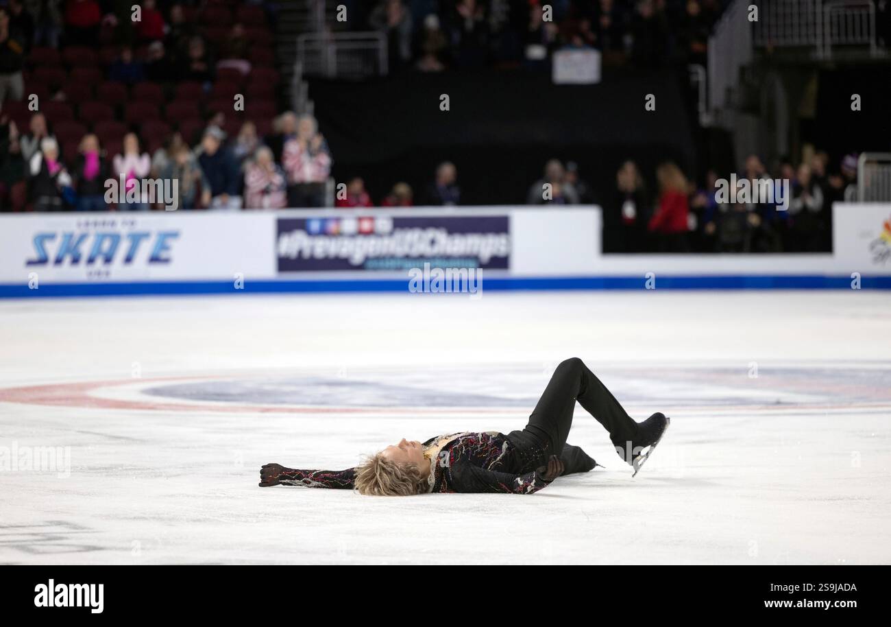 Ilia Malinin lays on the ice after his performance at the men's free