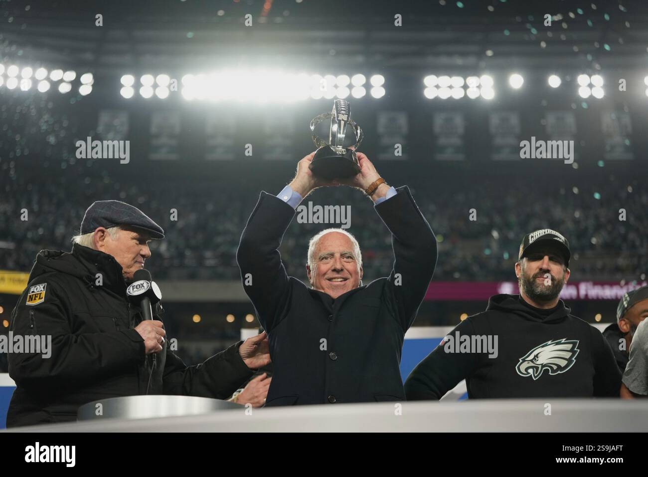 Philadelphia Eagles owner Jeffrey Lurie holds up the championship