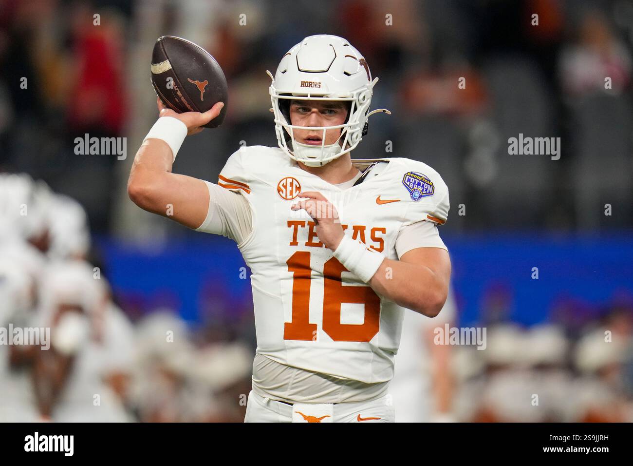 Texas quarterback Arch Manning (16) works out during the Cotton Bowl