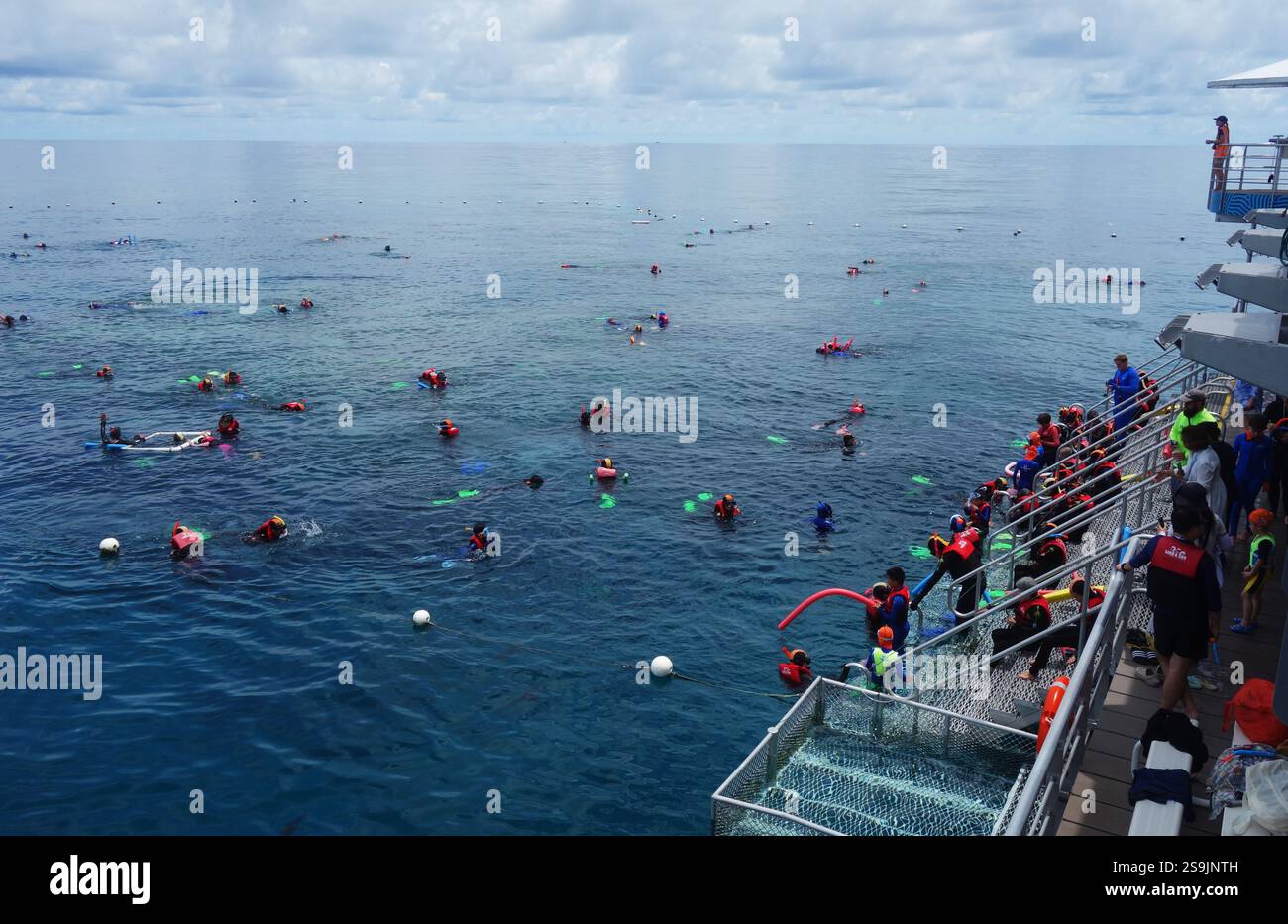 Busy day at the Reef Magic pontoon at Moore Reef, Great Barrier Reef Marine Park, Queensland, Australia. No MR or PR Stock Photo