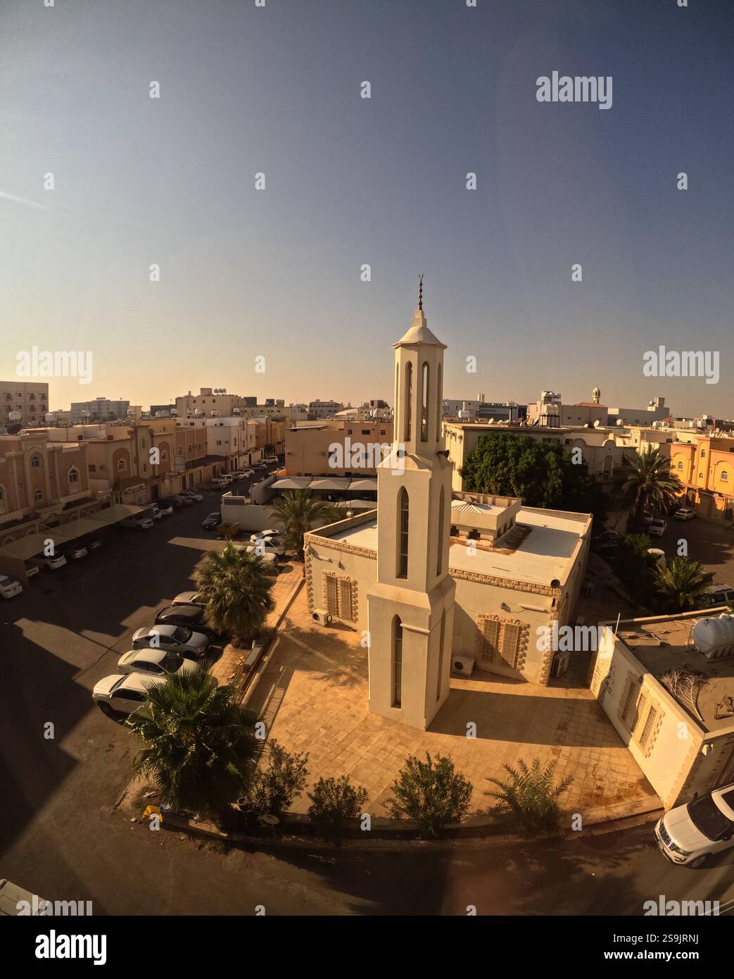Minaret and mosque oriented to Mecca despite street grid of central Tabuk, Saudi Arabia. No PR Stock Photo