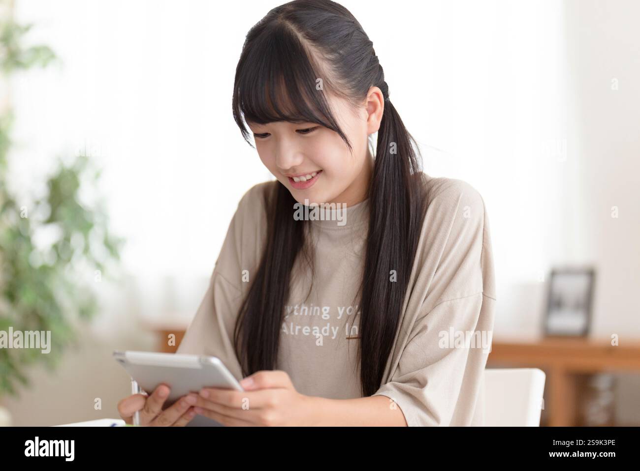 Junior high school students studying at home Stock Photo - Alamy
