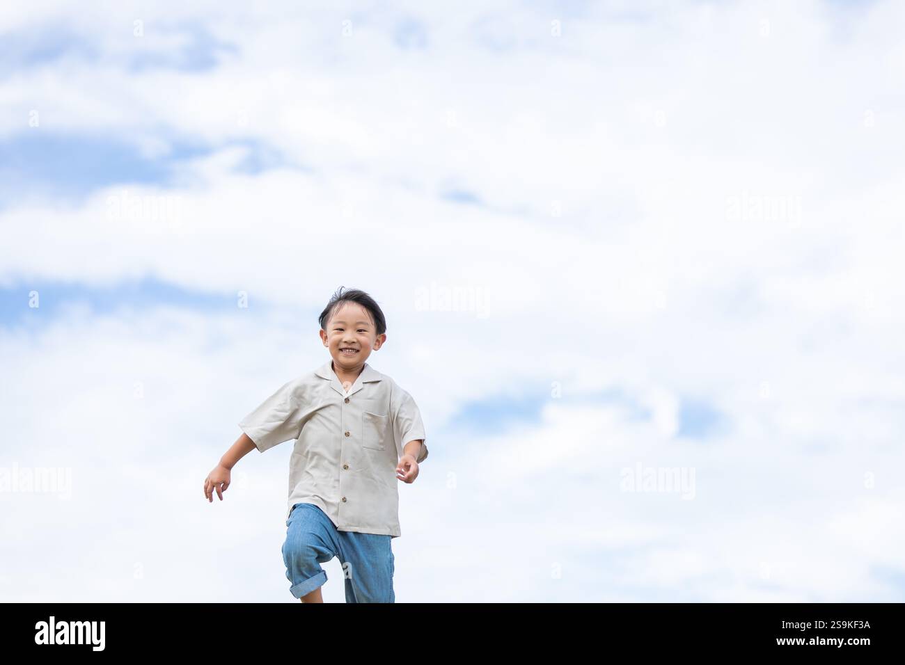 Running Around Smiling Boy running with a smile Stock Photo - Alamy