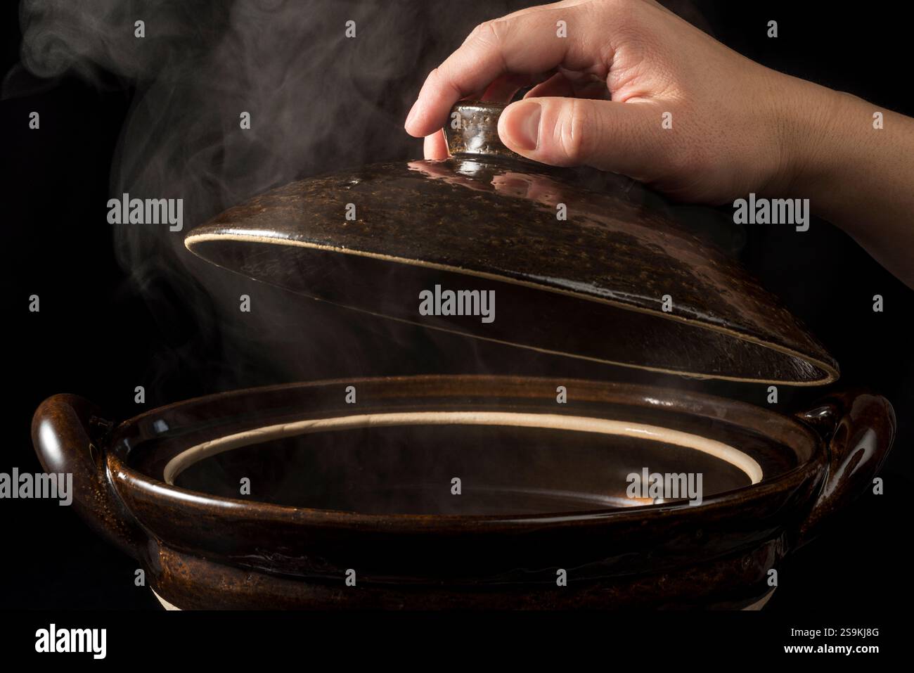 Steam rising from earthenware pot Stock Photo - Alamy