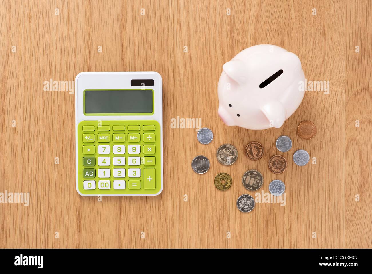 Calculator and piggy bank Stock Photo - Alamy