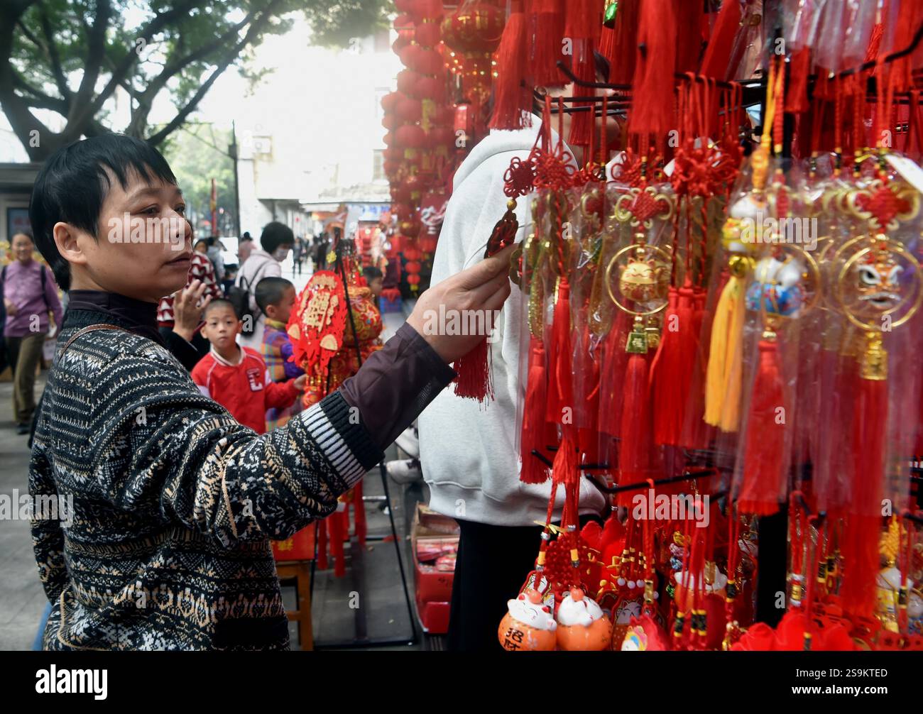 People select Spring Festival decorations in Guangzhou City, south