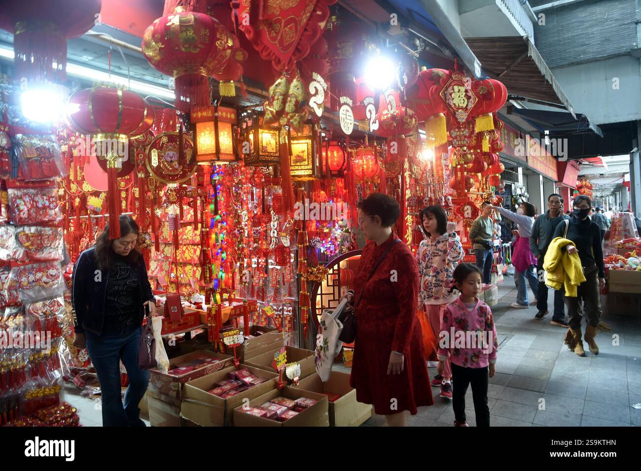 People select Spring Festival decorations in Guangzhou City, south