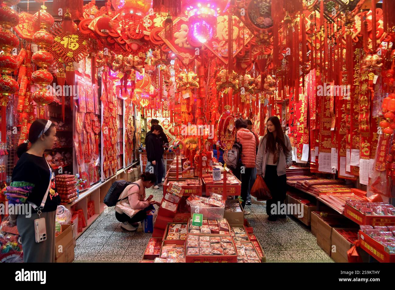 People select Spring Festival decorations in Guangzhou City, south