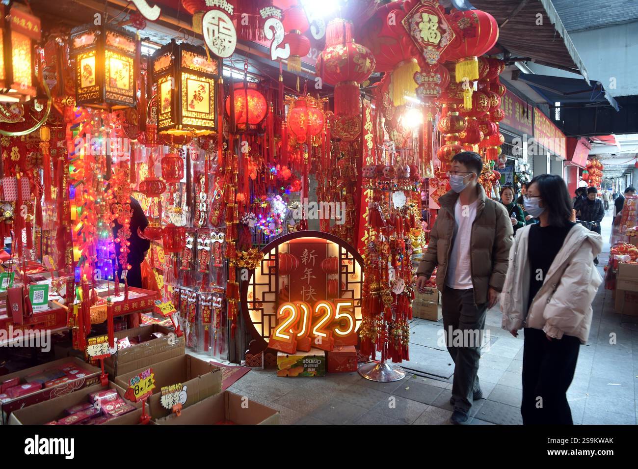 People select Spring Festival decorations in Guangzhou City, south