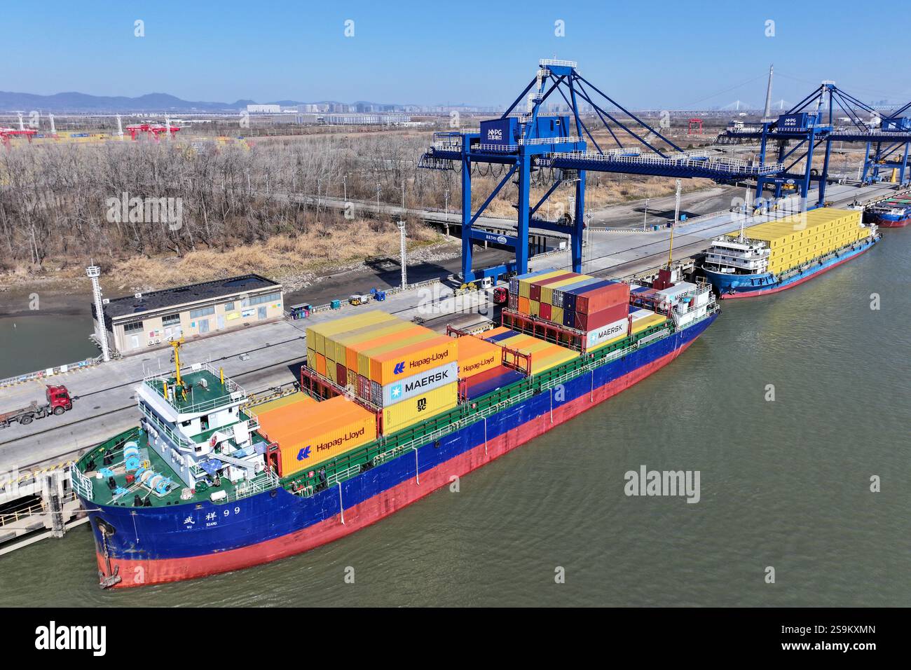 Jan Port NANJING, CHINA - JANUARY 27, 2025 - Cargo ships dock at the Qiba Port ...