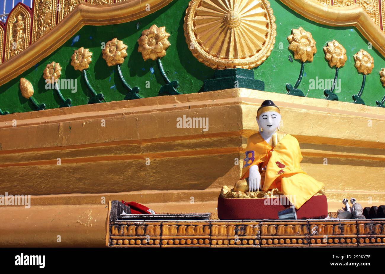 Old statue of meditating Buddha, Shwemawdaw Paya temple (Golden Temple), Bago, Bago Region, Myanmar (Burma). Stone figure of Buddha near to buddhist t Stock Photo