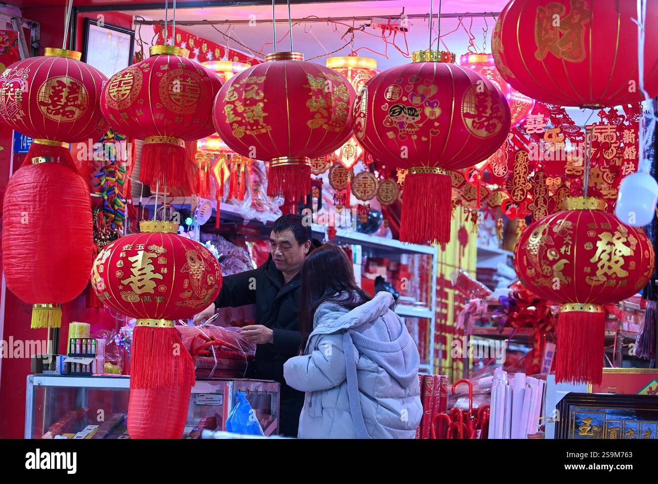 People select Spring Festival decorations at a market in Chongqing