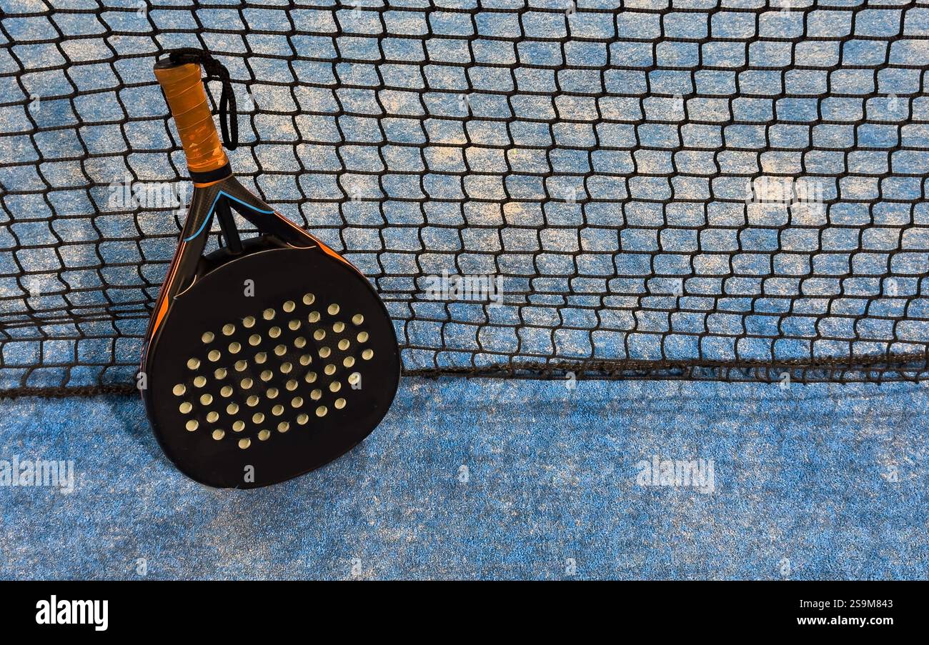 Padel tennis racket. Background with copy space. Sport court and balls ...