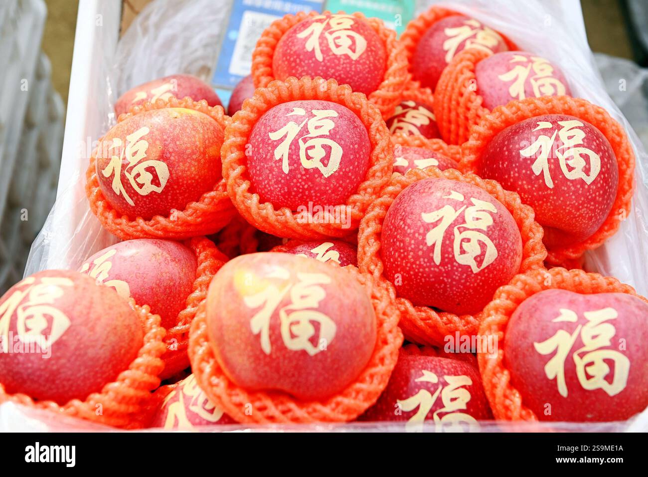 People buy Spring Festival goods at a market in Qingdao City, east
