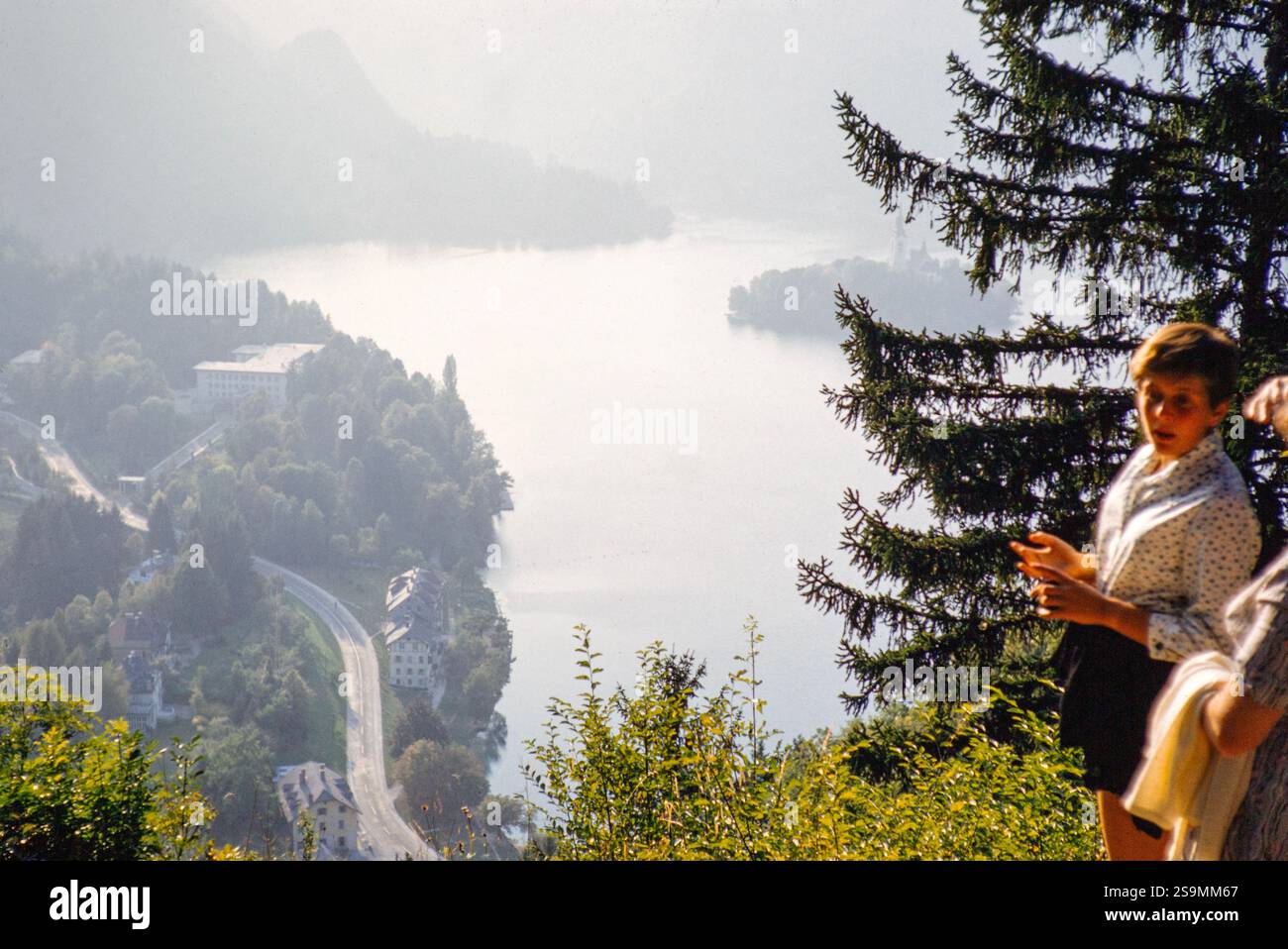 People looking down at lakeside villa owned by Marshal Tito, Lake Bled, Slovenia, former Yugoslavia, Europe 1959 Stock Photo